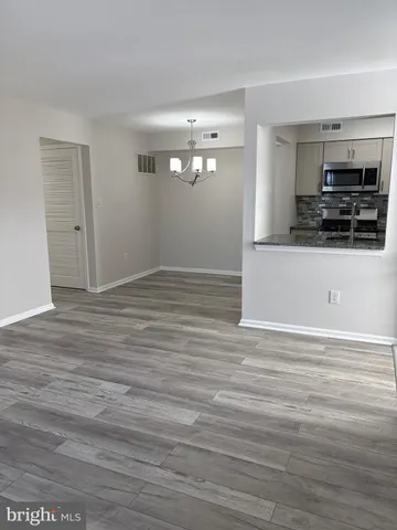a view of a kitchen from the hallway