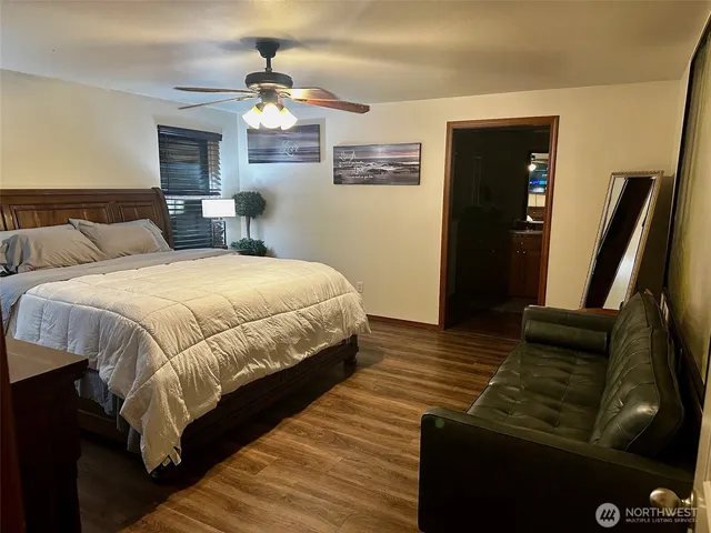 a bedroom with a bed and dresser