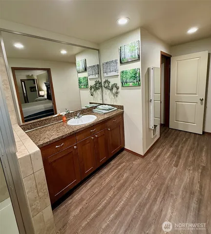 a kitchen with stainless steel appliances granite countertop a refrigerator and a stove