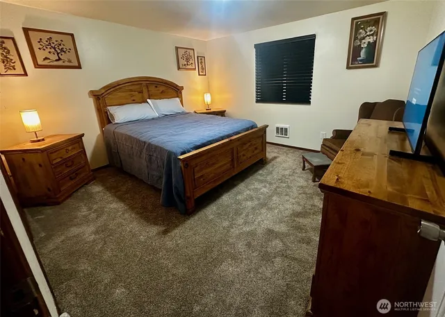 a bedroom with a bed and furniture