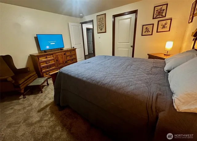 a bedroom with a bed and furniture