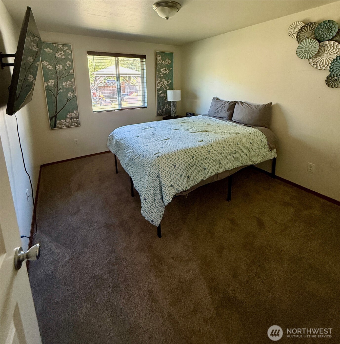 381 Elk Valley Road Forks, WA 98331 - Photo 19 of 26 a bedroom with a bed and a window