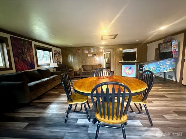 a view of a dining room with furniture window and wooden floor