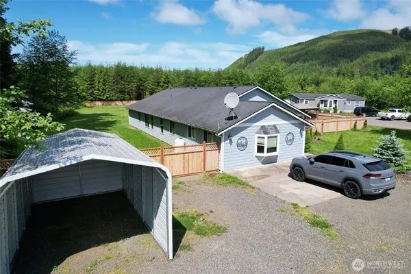 a house with trees in the background