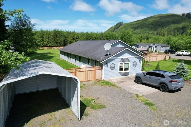 a house with trees in the background