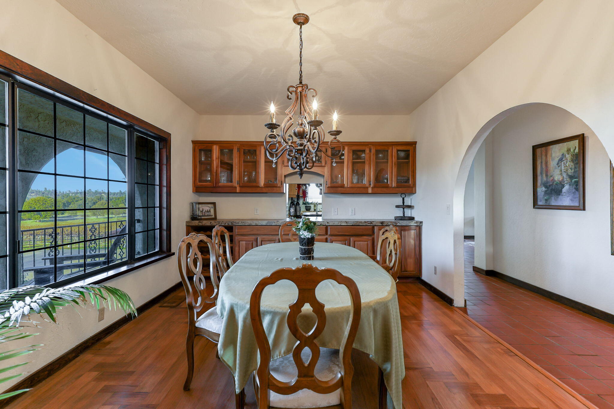 22797 Silverlode Lane Palo Cedro, CA 96073 - Photo 13 of 64 a dining room with furniture a chandelier and wooden floor