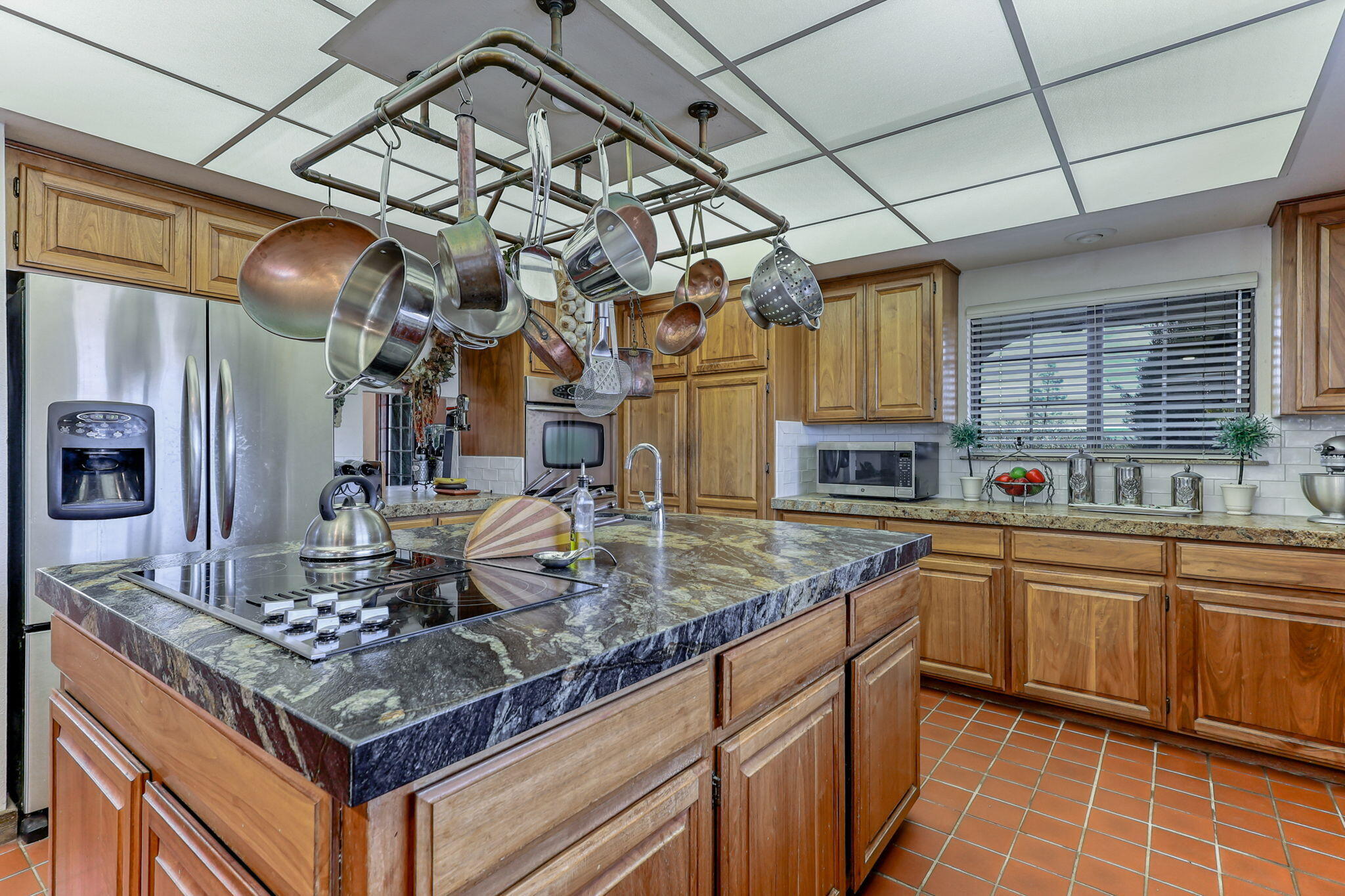 22797 Silverlode Lane Palo Cedro, CA 96073 - Photo 18 of 64 a kitchen with stainless steel appliances granite countertop a sink a stove and cabinets