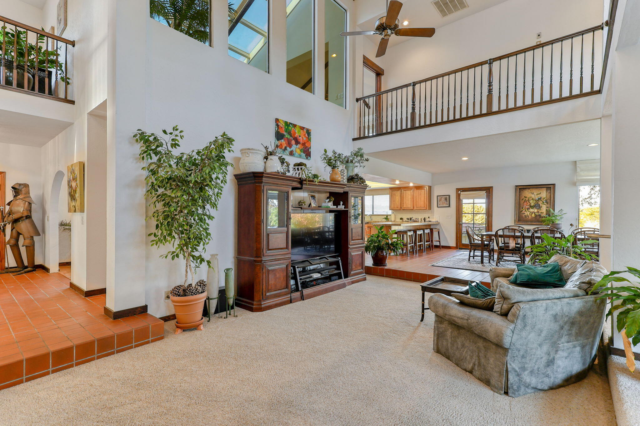 22797 Silverlode Lane Palo Cedro, CA 96073 - Photo 23 of 64 a living room with furniture a flat screen tv and a potted plant