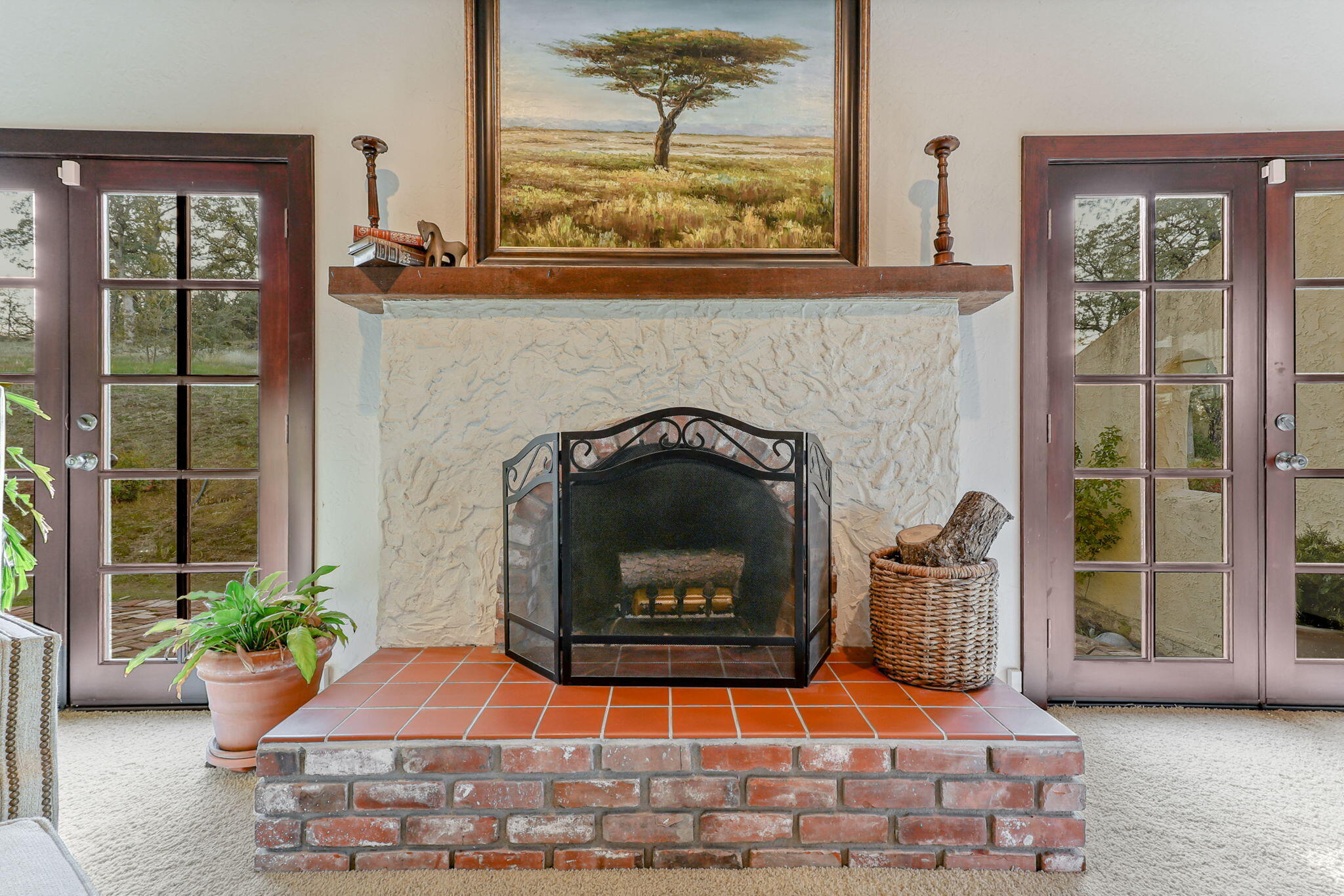 22797 Silverlode Lane Palo Cedro, CA 96073 - Photo 29 of 64 a living room with a fireplace and potted plants