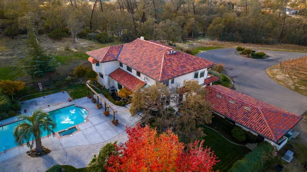 an aerial view of a house with a garden