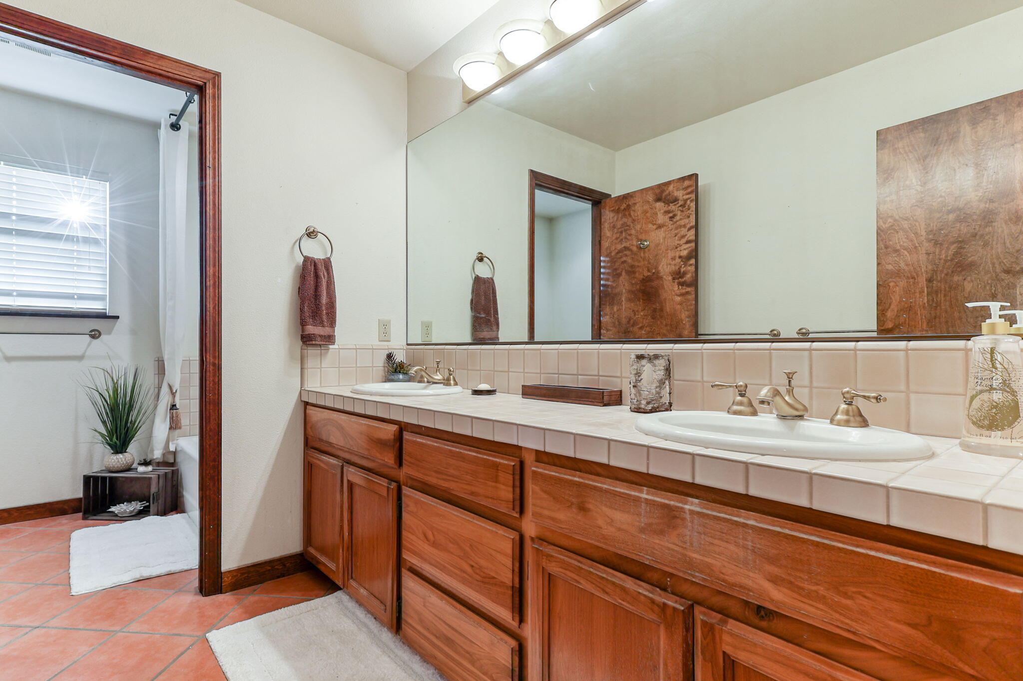 22797 Silverlode Lane Palo Cedro, CA 96073 - Photo 35 of 64 a en suite bathroom with double sink and a mirror