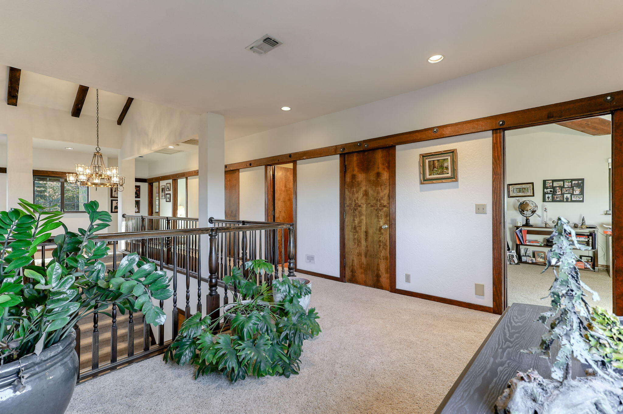 22797 Silverlode Lane Palo Cedro, CA 96073 - Photo 37 of 64 a living room with furniture and a potted plant