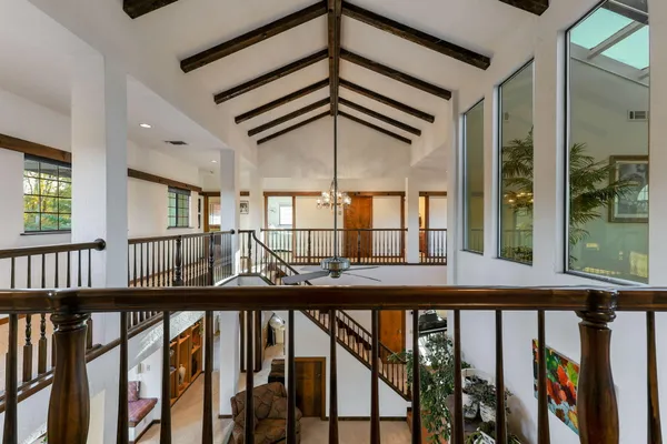 a en suite bathroom with a granite countertop tub and a large mirror