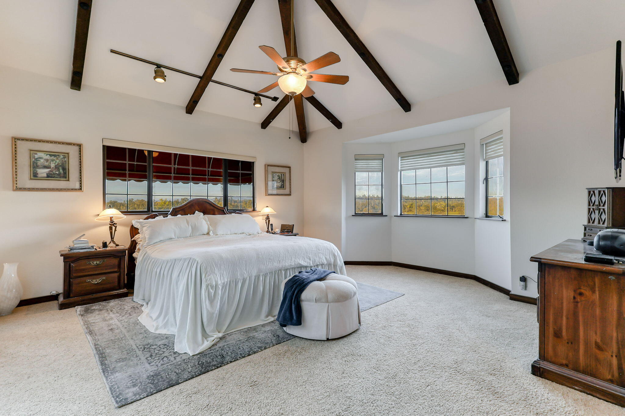22797 Silverlode Lane Palo Cedro, CA 96073 - Photo 42 of 64 a bedroom with a bed and wooden floor