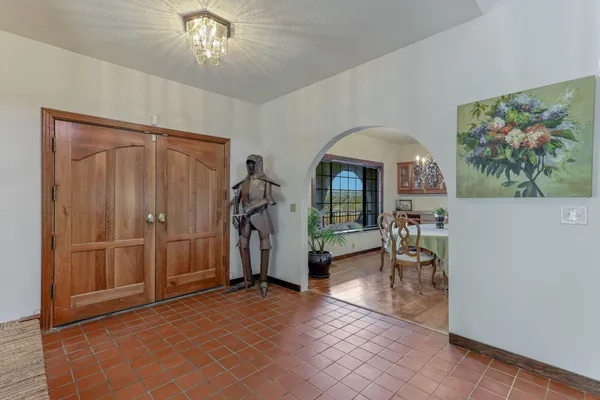 a view of a livingroom with furniture and a hallway