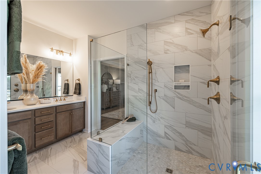 6607 Mayland Rdg Lane; Moseley, VA 23120 - Photo 15 of 15 a bathroom with a double vanity sink mirror and shower