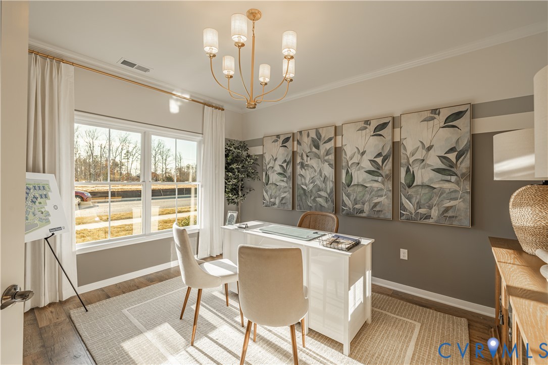 6607 Mayland Rdg Lane; Moseley, VA 23120 - Photo 2 of 15 a view of a dining room with furniture window and outside view