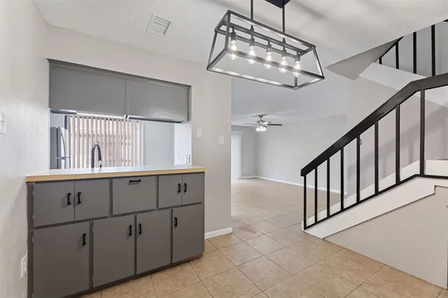 a view of cabinets and chandelier