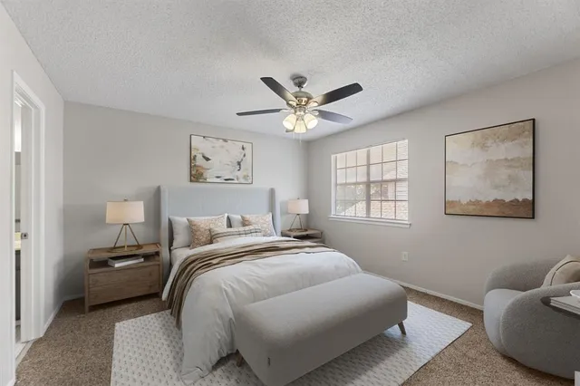 a bedroom with bed and a window