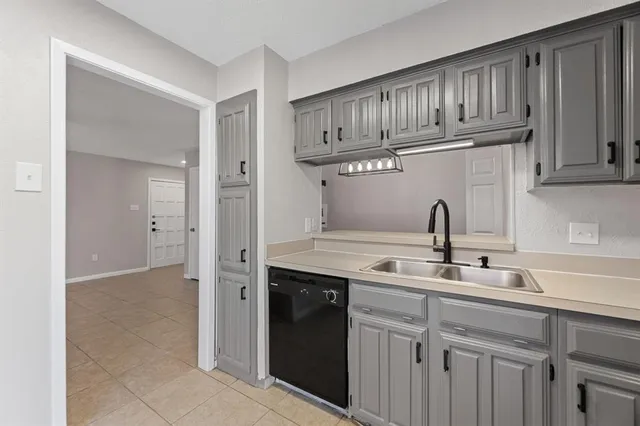 a kitchen with stainless steel appliances granite countertop a sink and cabinets