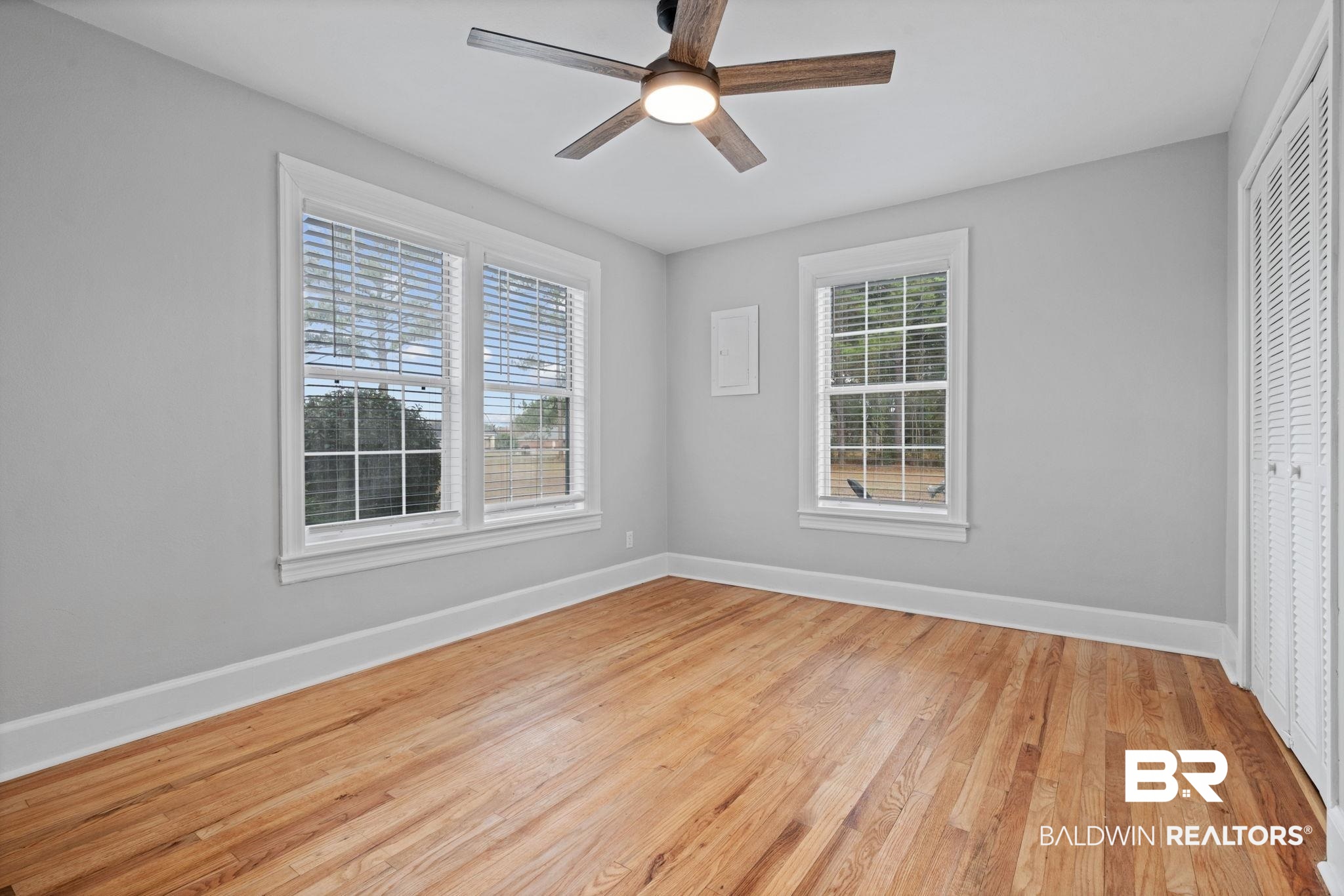 13461 Tom Gaston Road Mobile, AL 36695 - Photo 22 of 41 Empty room with light wood-style floors and ceiling fan