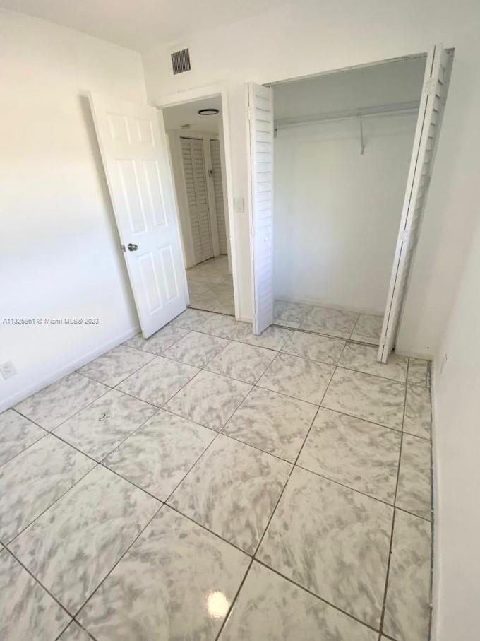 850 Southwest 74th Terrace, Unit 2 Pompano Beach, FL 33068 - Photo 11 of 11 a view of an empty room