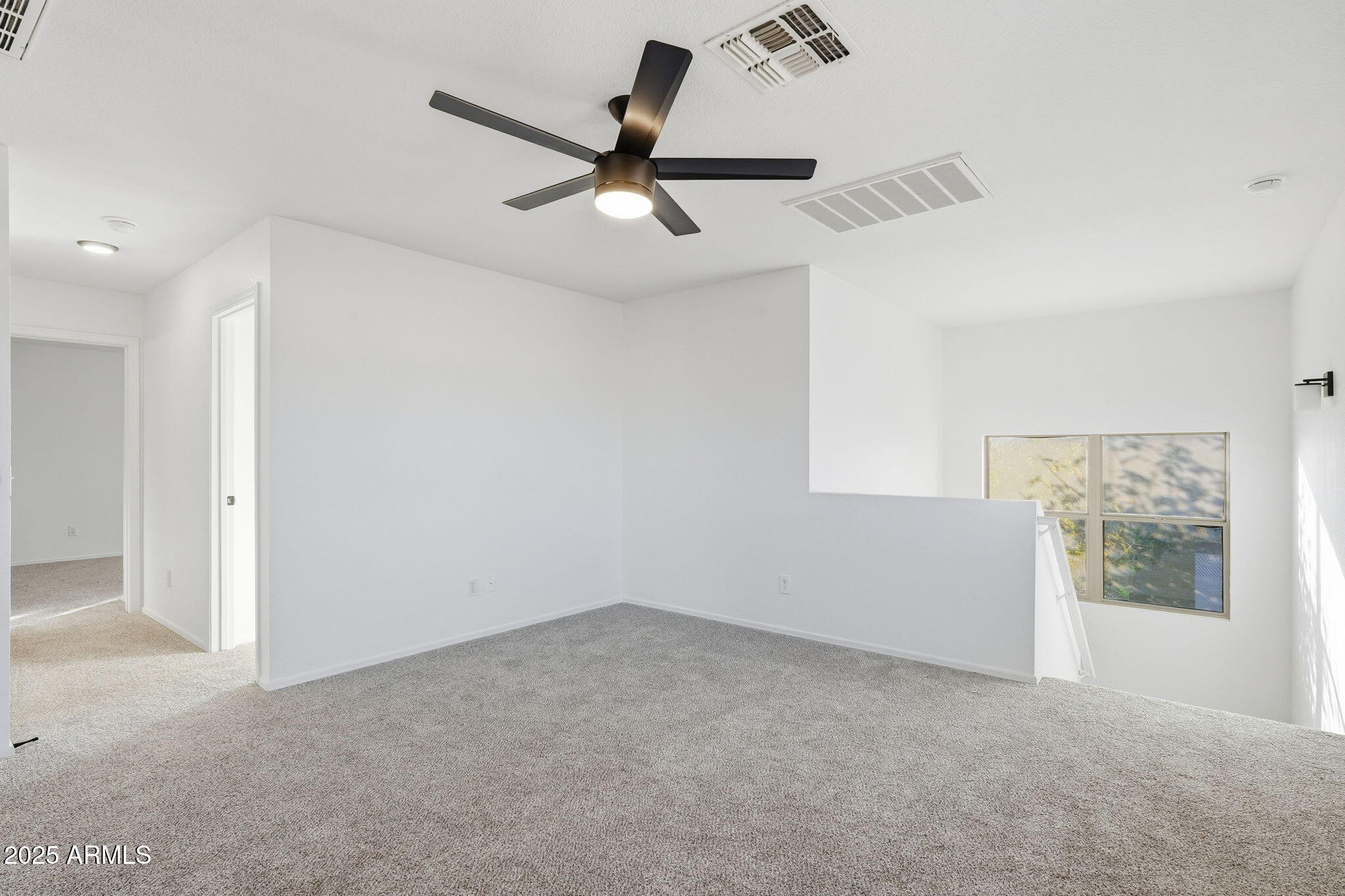 3287 South Bowman Road Apache Junction, AZ 85119 - Photo 17 of 40 wooden floor in an empty room with a window