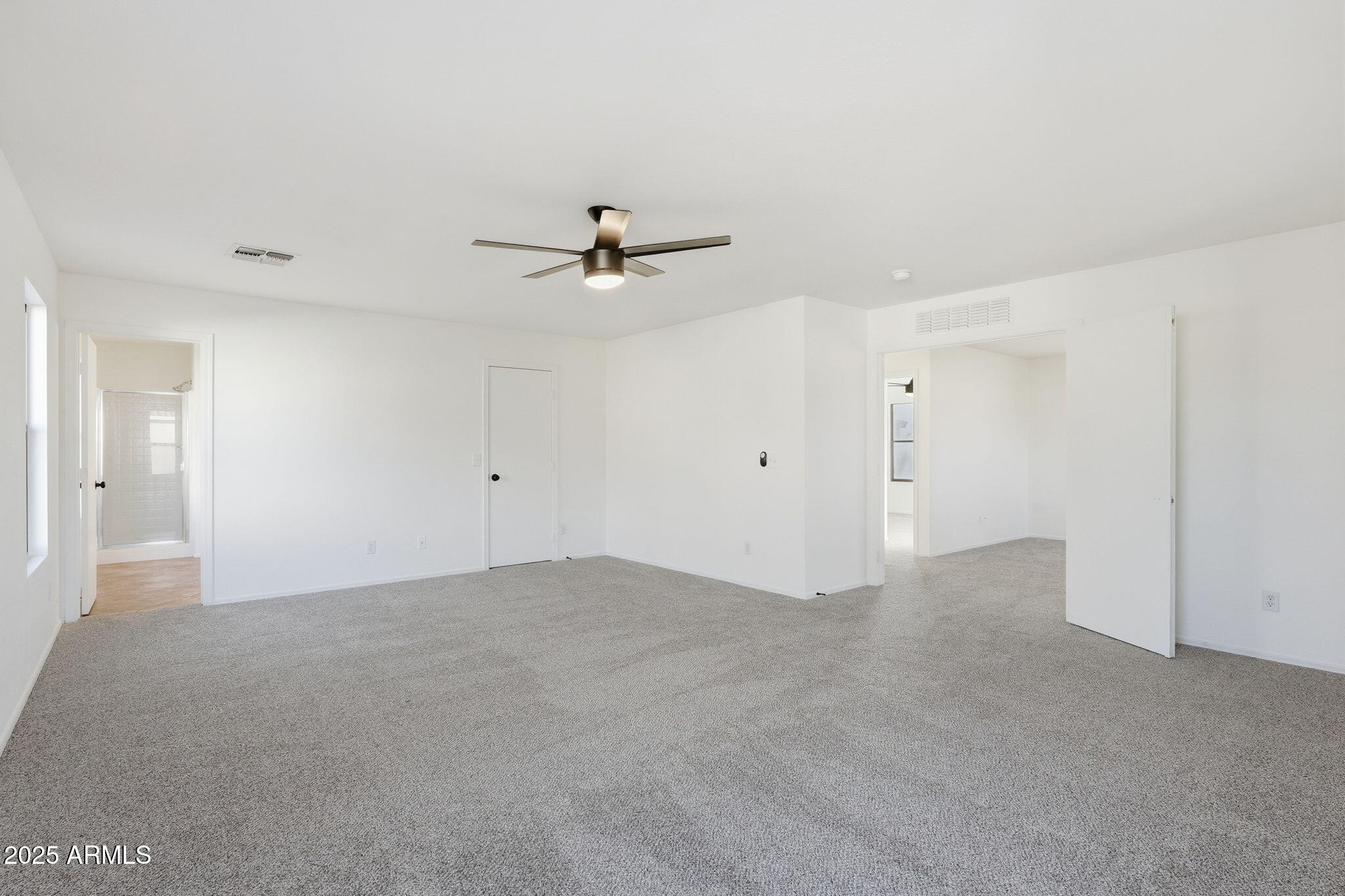 3287 South Bowman Road Apache Junction, AZ 85119 - Photo 20 of 38 a view of an empty room with a ceiling fan
