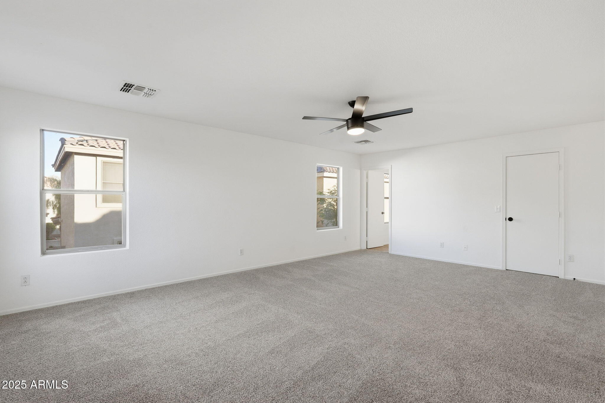 3287 South Bowman Road Apache Junction, AZ 85119 - Photo 20 of 40 a view of an empty room with a window
