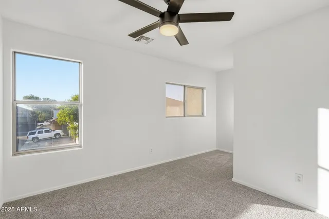 a view of an empty room and window