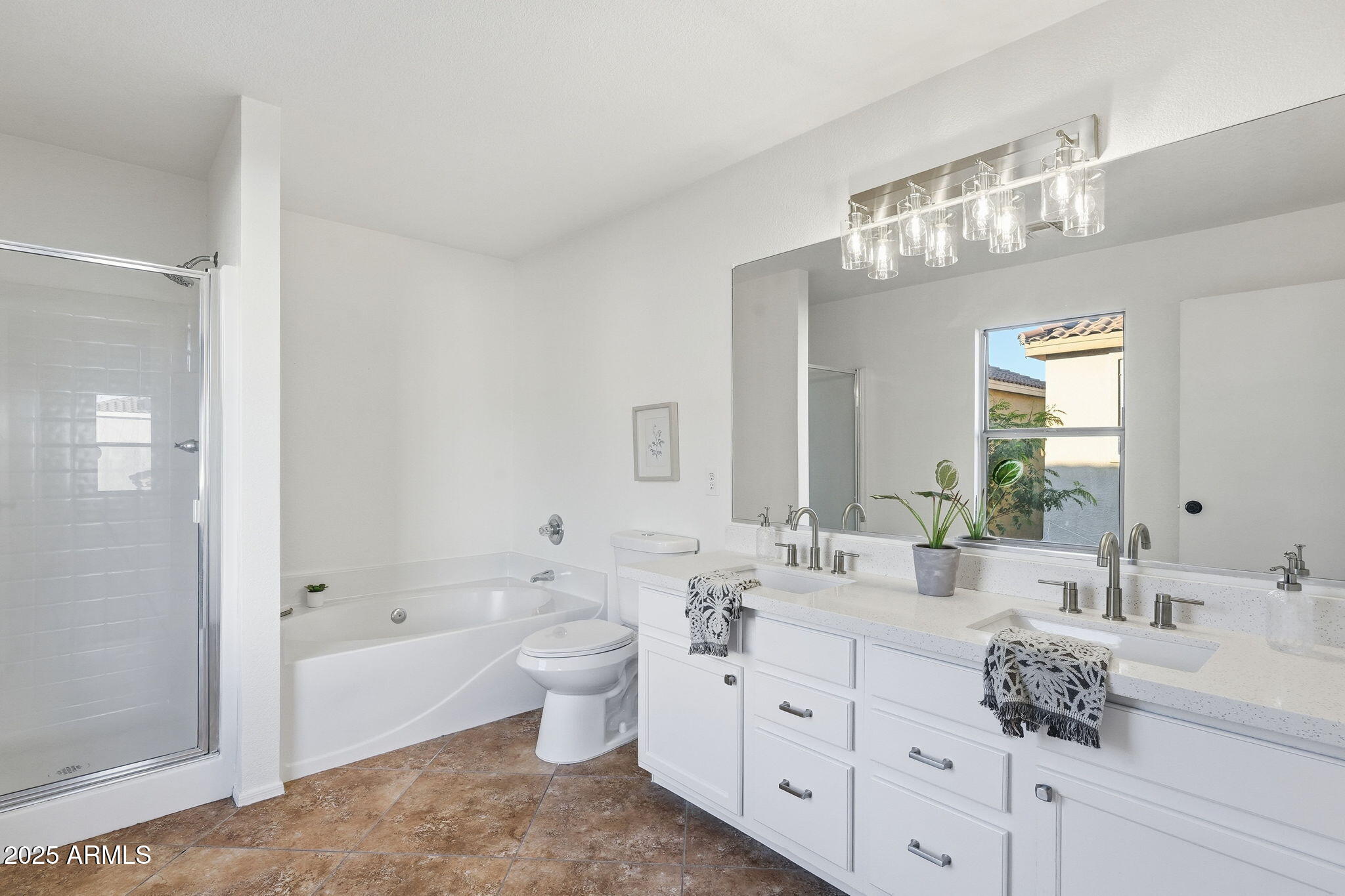 3287 South Bowman Road Apache Junction, AZ 85119 - Photo 24 of 40 a spacious bathroom with double sink a large mirror and bathtub