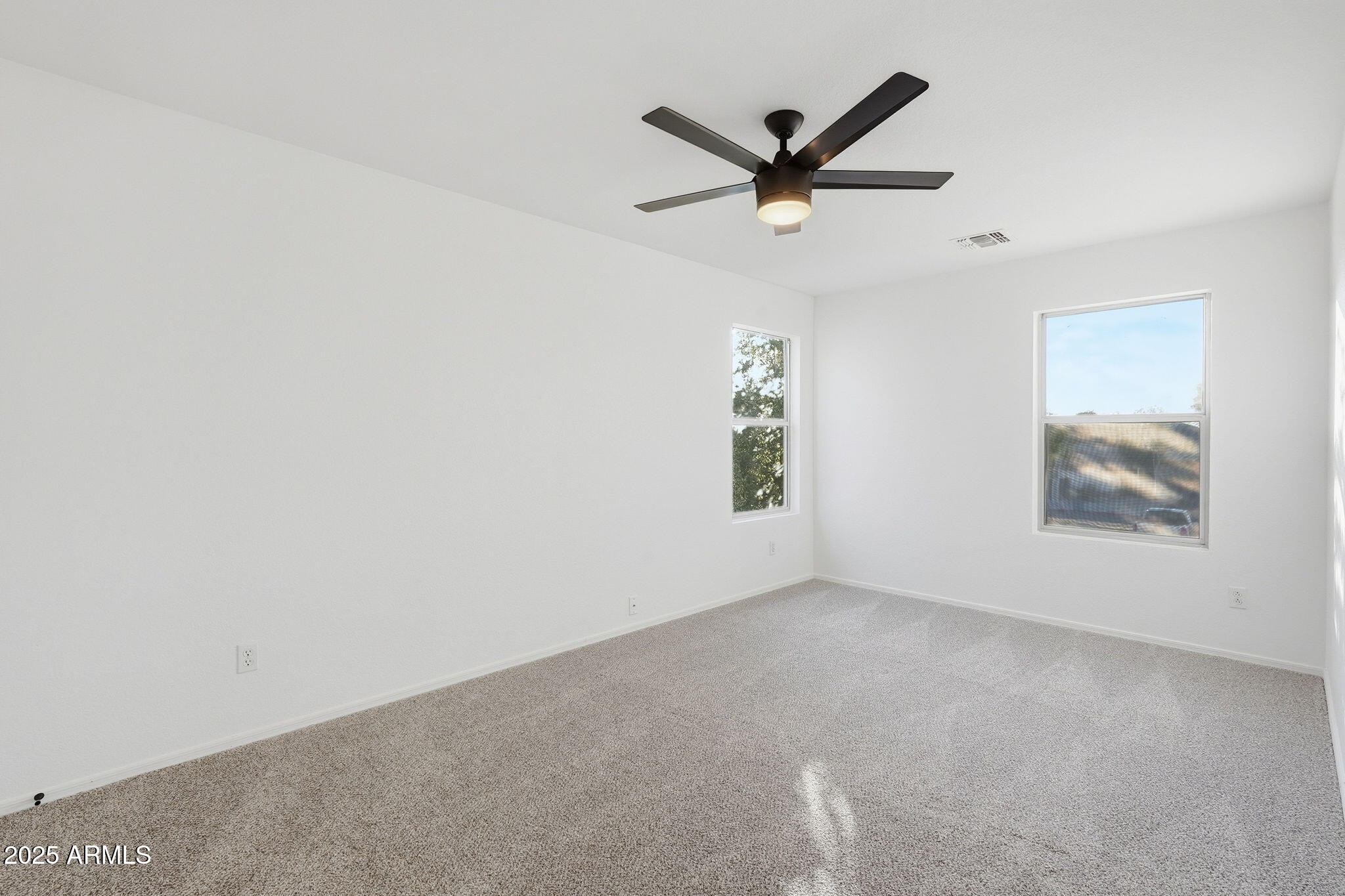 3287 South Bowman Road Apache Junction, AZ 85119 - Photo 29 of 40 a view of a big room with ceiling fan and windows
