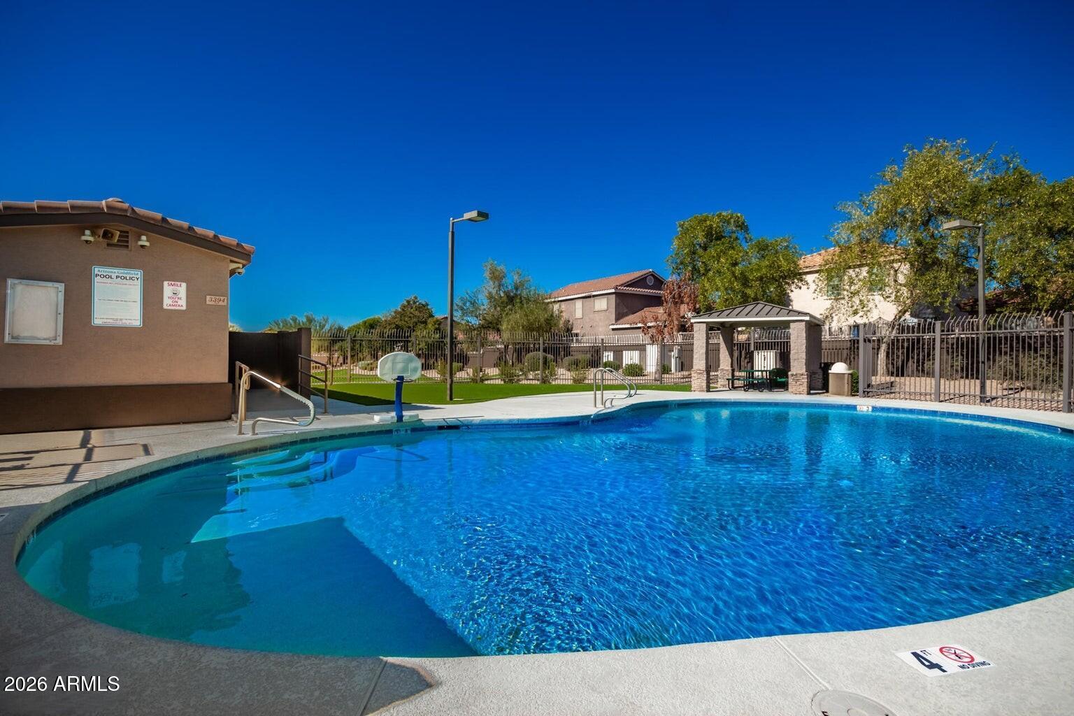 3287 South Bowman Road Apache Junction, AZ 85119 - Photo 36 of 40 a view of a house with swimming pool