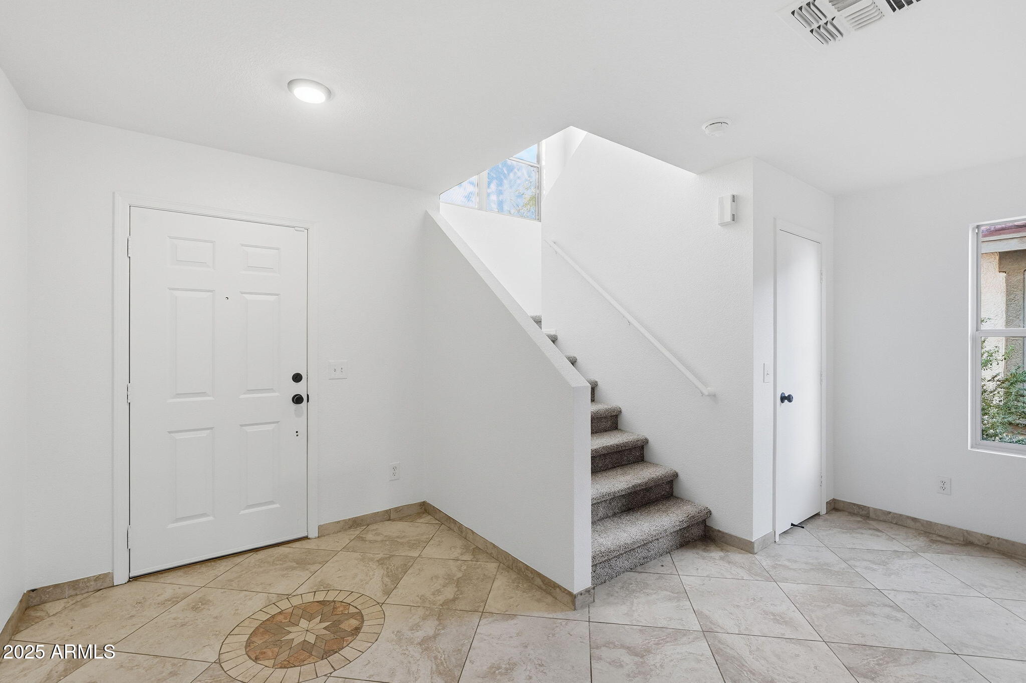 3287 South Bowman Road Apache Junction, AZ 85119 - Photo 4 of 40 a view of an entryway with staircase