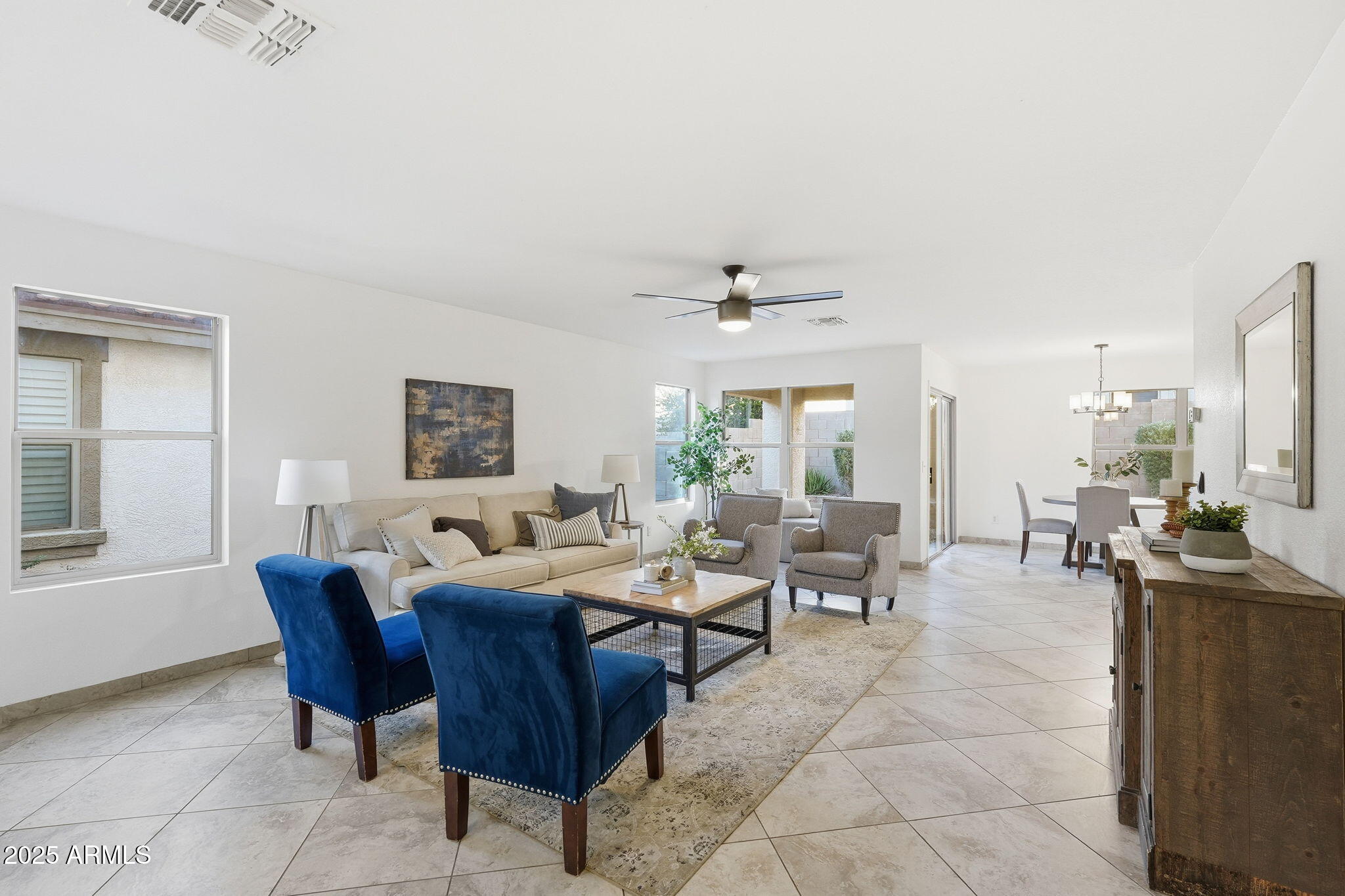 3287 South Bowman Road Apache Junction, AZ 85119 - Photo 5 of 40 a living room with furniture and a large window
