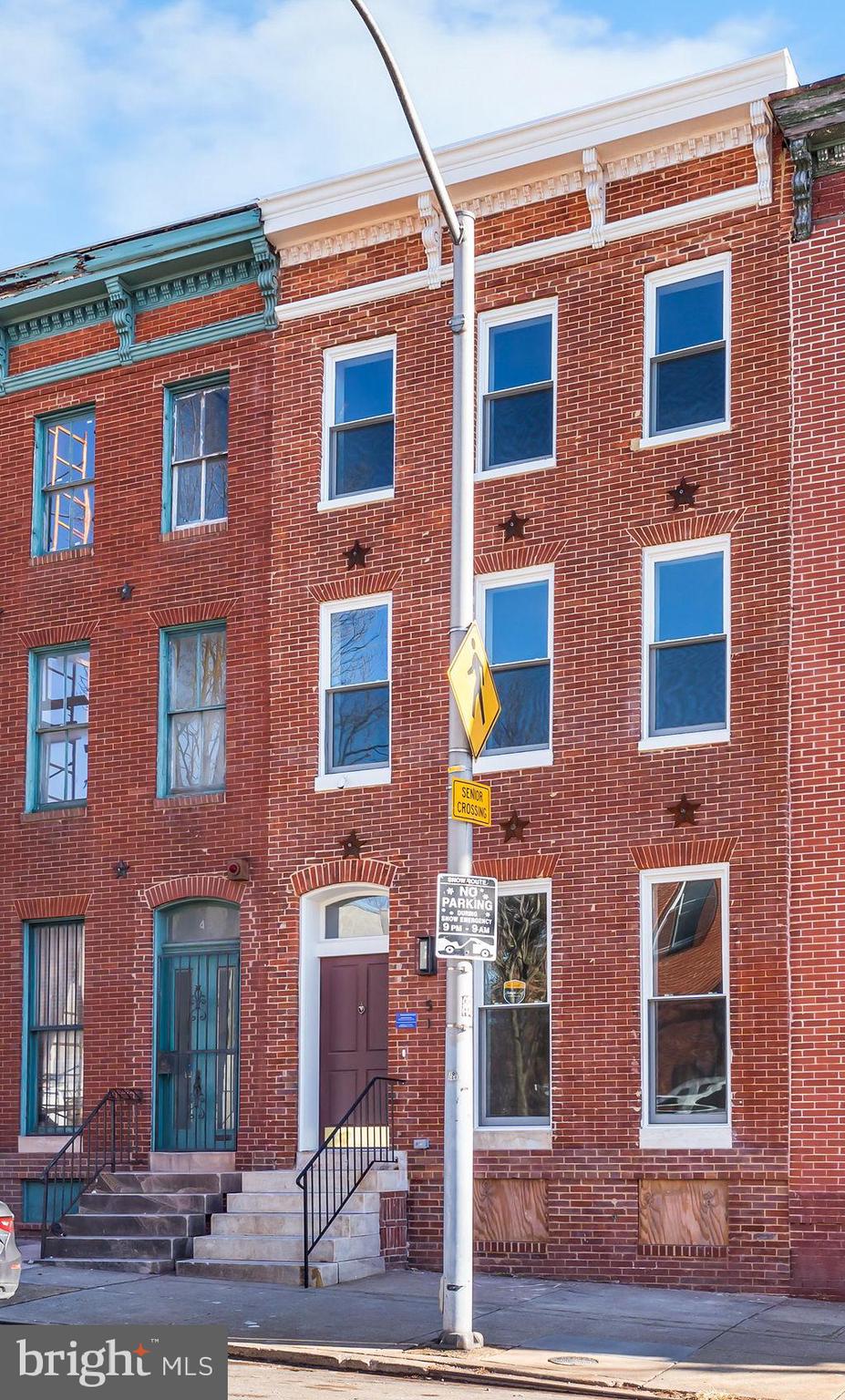 51 South Fulton Avenue Baltimore, MD 21223 - Photo 3 of 44 a front view of a multi story residential apartment building