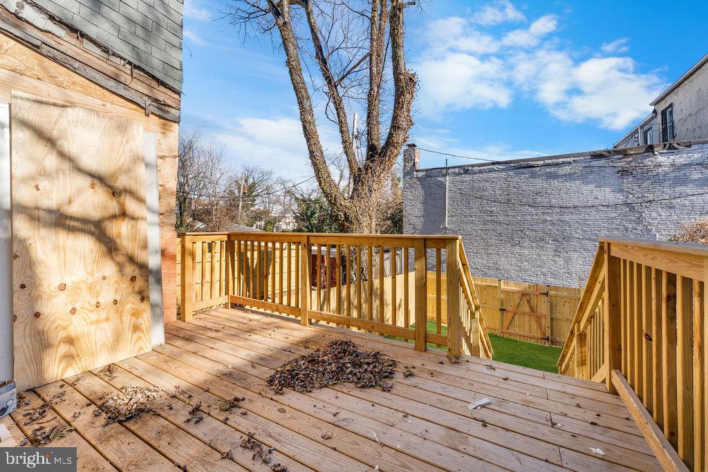 51 South Fulton Avenue Baltimore, MD 21223 - Photo 36 of 44 a view of a balcony with wooden floor