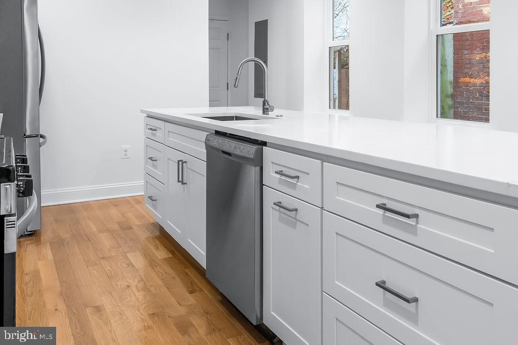 51 South Fulton Avenue Baltimore, MD 21223 - Photo 10 of 44 a bathroom with a sink and a mirror