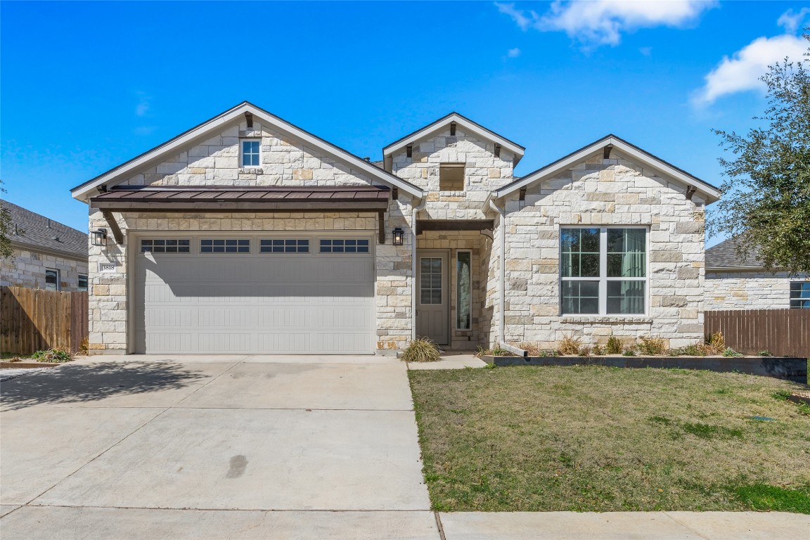 3818 Chance Loop Round Rock, TX 78628 - Photo 1 of 1 a front view of a house with a yard