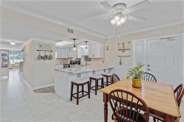 a kitchen with stainless steel appliances granite countertop a sink and stove