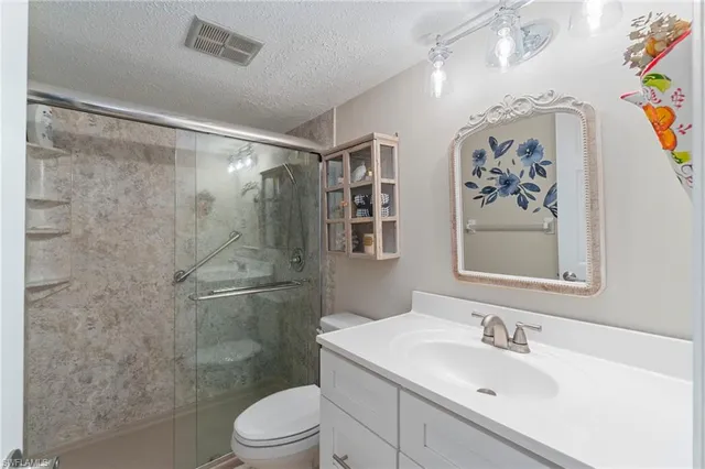 a bathroom with a shower and toilet