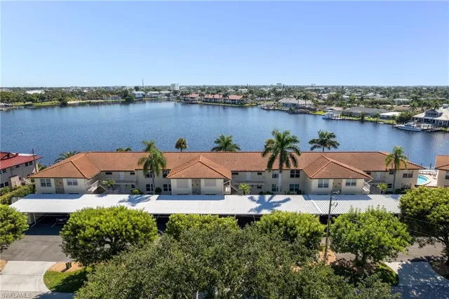 an aerial view of a house with a ocean view