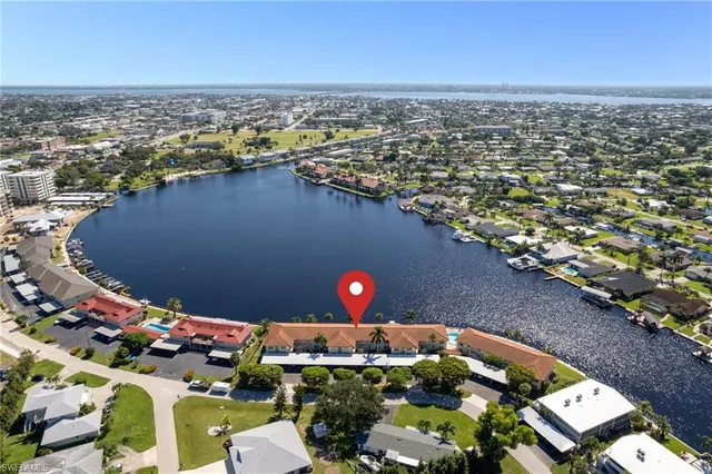 an aerial view of a house with a ocean view