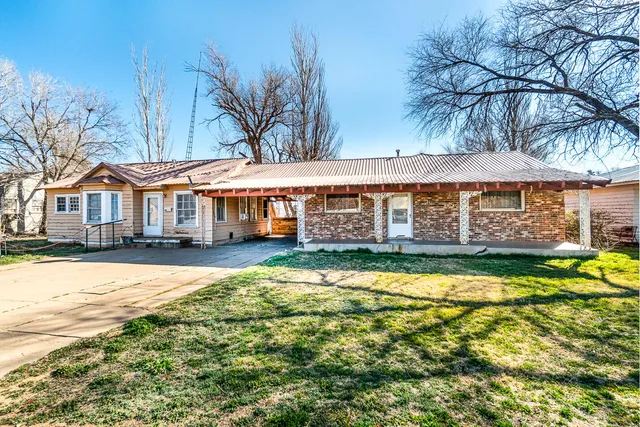 a front view of a house with swimming pool