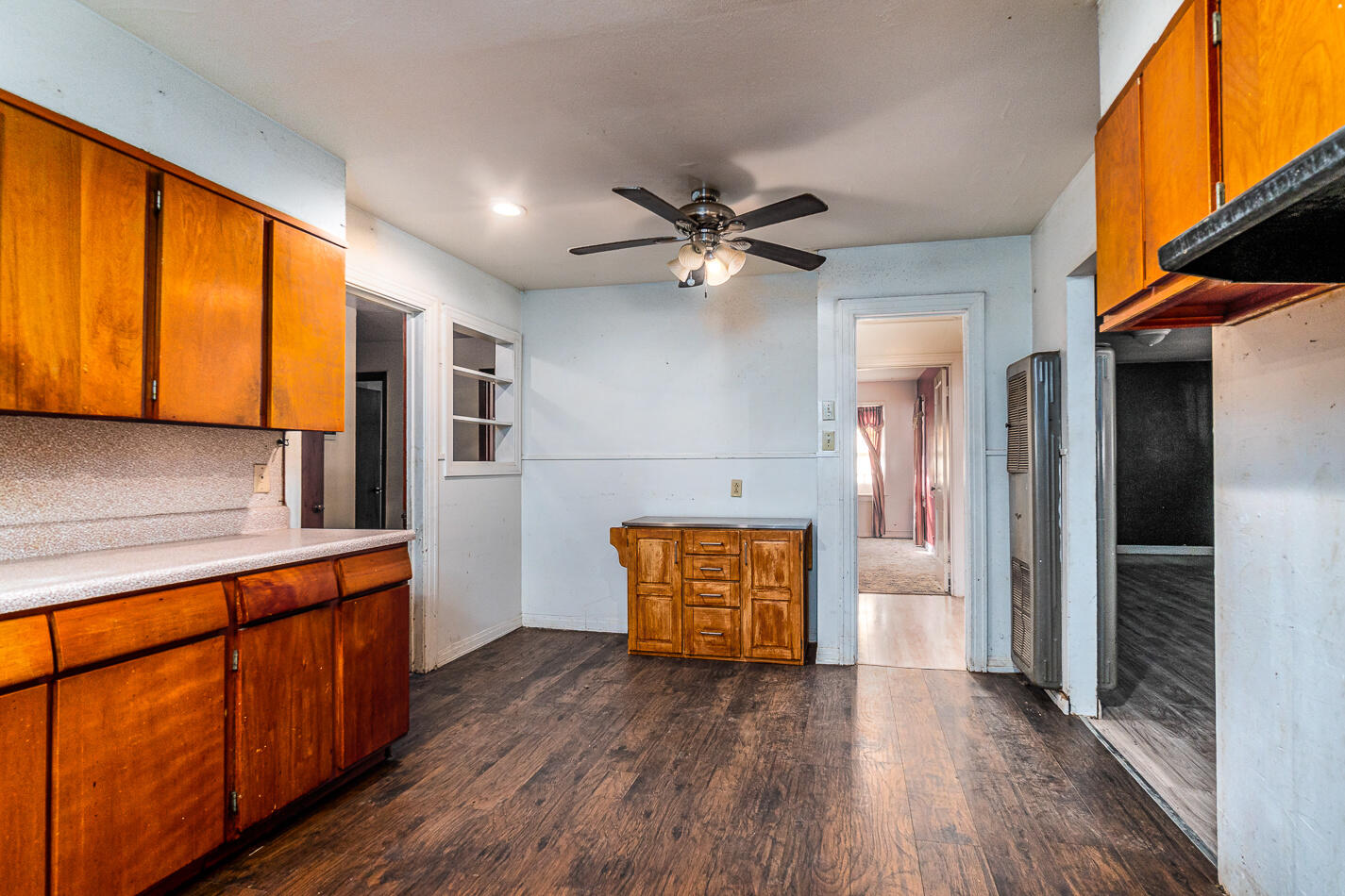 210 North Floyd Avenue Tulia, TX 79088 - Photo 11 of 35 a view of a kitchen with a sink and a refrigerator