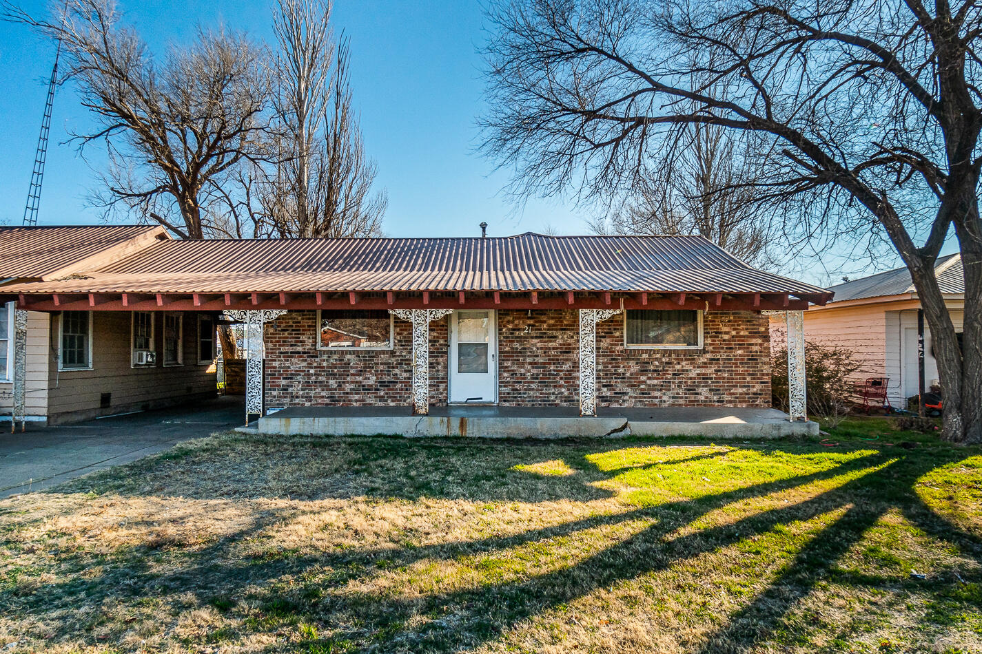 210 North Floyd Avenue Tulia, TX 79088 - Photo 2 of 35 a view of a house with swimming pool and porch with furniture