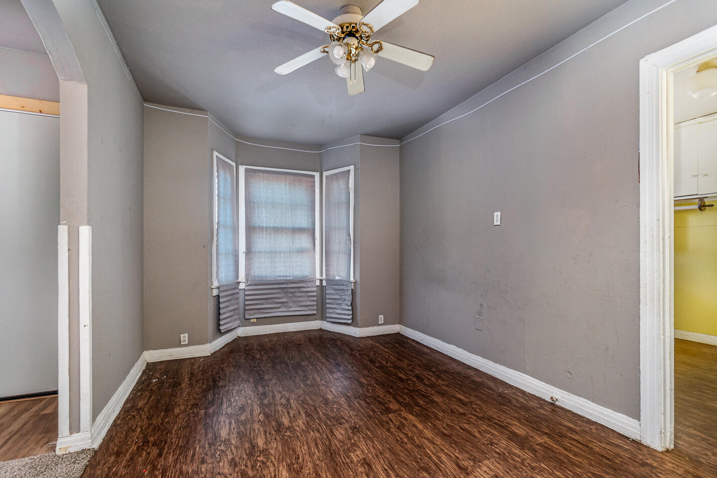 210 North Floyd Avenue Tulia, TX 79088 - Photo 25 of 35 wooden floor in an empty room with a window
