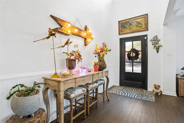 a dining room with furniture and wooden floor