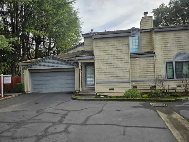 a front view of a house with garage