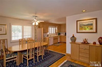 a view of a dining room with furniture and window